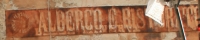 Vecchia scritta sul muro di un edificio di via Daicceto